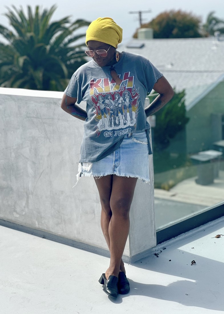 Model in KISS tee on rooftop